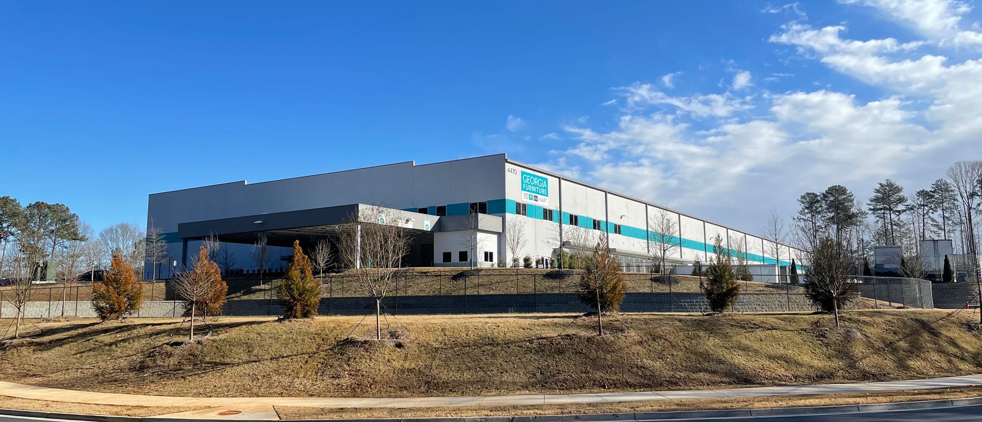 A large building with many windows on the side of it.