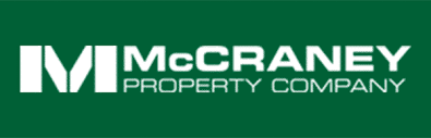 A green background with white letters that say mccrory property.