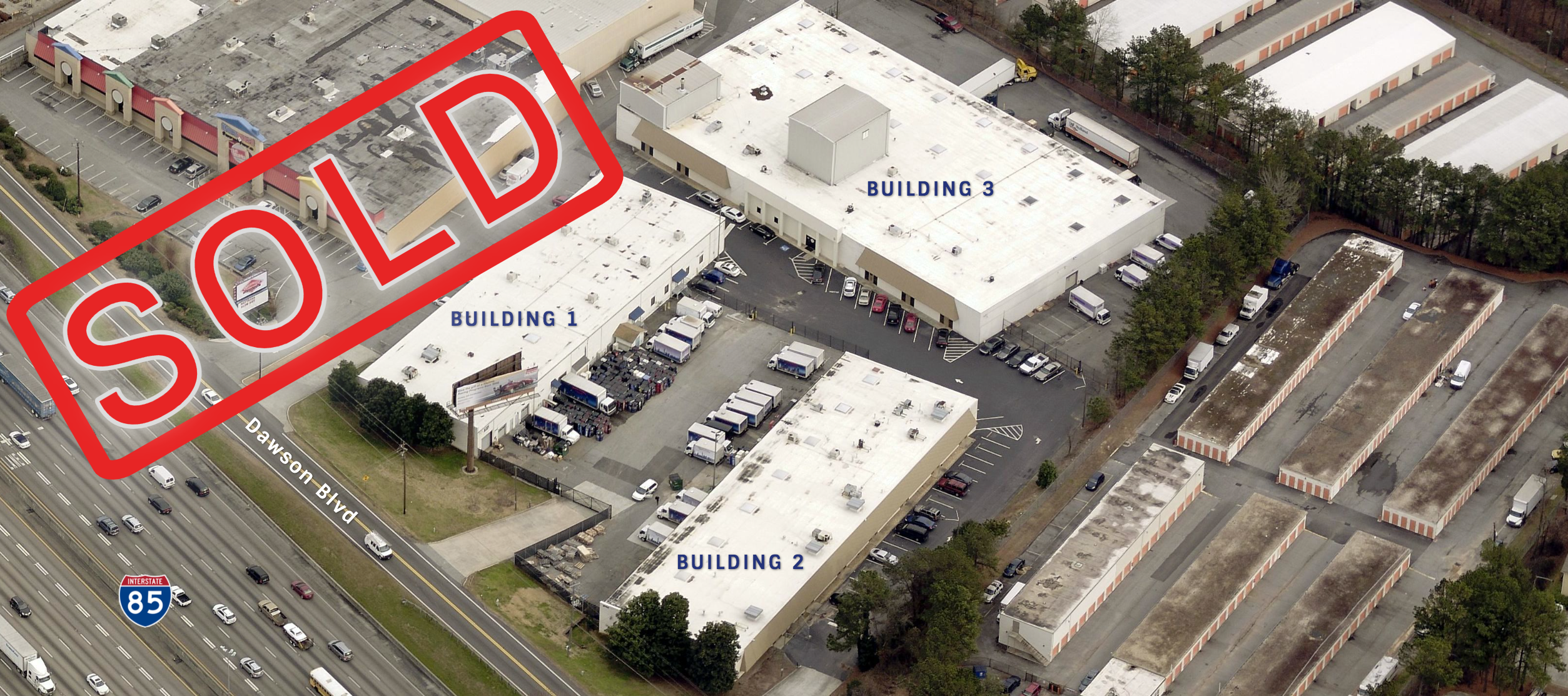 A red sold sign is in the center of this aerial photo.